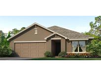 Charming single-story home with a two-car garage and a well-manicured lawn and landscaped garden at 1429 Brown Mallet Pl, Ruskin, FL 33570