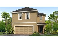 Two-story home with a two-car garage, stucco siding, and well-manicured landscaping at 5527 Warrington Town Path, Wesley Chapel, FL 33545