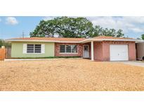 Charming single-story home with a brick facade and well-maintained, low maintenance rock landscaping at 1758 Southview Rd, Largo, FL 33770