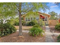 Inviting home exterior with mature trees, green foliage, and sidewalk approach at 3120 8Th N Ave, St Petersburg, FL 33713