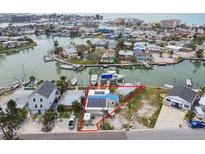 Waterfront home in a neighborhood with boat docks, canal access, and water views at 301 Boca Ciega Dr, Madeira Beach, FL 33708