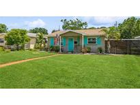 Charming single-story home with a lush green lawn and cheerful curb appeal at 5638 13Th N Ave, St Petersburg, FL 33710