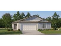 Charming single-Gathering home featuring vertical siding, a two-car garage, and a well-maintained front lawn at 8116 Painted Sky Pl, Land O Lakes, FL 34637
