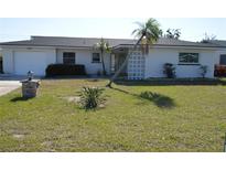Charming single-story home featuring well-maintained landscaping, palm trees, and a welcoming exterior at 9093 108Th St, Seminole, FL 33772