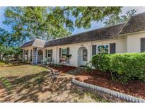 Charming single-story home featuring a well-maintained lawn, mulch beds, and decorative shutters enhancing curb appeal at 4252 Sheldon Pl # 4252, New Port Richey, FL 34652