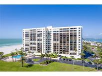 Beautiful beachfront condominium with a pool, parking, lush greenery, and stunning water views at 1460 Gulf Blvd # 406, Clearwater Beach, FL 33767
