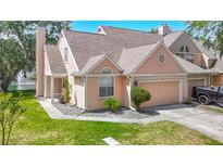 Charming two-story townhome with a well-manicured lawn and a single-car garage in a desirable neighborhood at 3611 Pine Knot Dr, Valrico, FL 33596