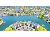 Aerial view showcasing beautiful waterfront homes, community amenities, and scenic surroundings at 772 Gran Kaymen Way, Apollo Beach, FL 33572