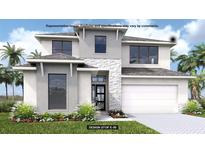Modern two-story home featuring stone accents, a two-car garage, and tropical landscaping at 3816 109Th Street East, Palmetto, FL 34221