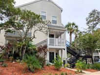 Inviting condominium with well-maintained landscaping and charming second-story balcony at 3305 Haviland Ct # 301, Palm Harbor, FL 34684