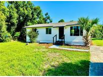 Charming single-story home features a well-maintained lawn and beautiful landscaping at 26448 Eager Rd, Punta Gorda, FL 33955
