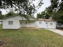 Charming single-story home with a well-maintained lawn and inviting front porch at 3918 E Clifton St, Tampa, FL 33610