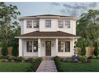 Charming two-story home with a welcoming front porch, landscaped garden, and beautiful curb appeal at 445 36Th N Ave, St Petersburg, FL 33704