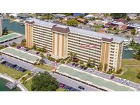 Beautiful building exterior view showcasing parking and entrance access at 4725 Cove Cir # 810, St Petersburg, FL 33708