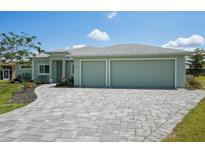 Charming one-story home with a well-manicured lawn and a two-car garage at 7504 Carissa, Punta Gorda, FL 33955