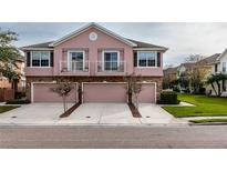 Charming townhome with two stories, garage, balconies, and manicured landscaping at 584 52Nd N Ave, St Petersburg, FL 33703