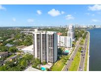 Stunning aerial view of a high rise condo complex, pool, and waterfront at 2413 Bayshore Blvd # 801, Tampa, FL 33629