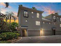 Charming multi-story townhome with attached garages and a well-manicured landscape at 501 Knights Run Ave # 5101, Tampa, FL 33602