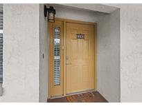 Inviting front door with a sidelight window and stylish exterior lighting at 2275 62Nd N Ave # 5202, St Petersburg, FL 33702