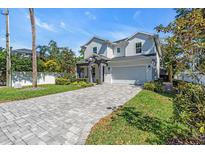 Beautiful two-story home with a charming facade and manicured landscaping at 4251 W Roland St, Tampa, FL 33609