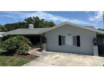 Charming single-story home with a well-manicured front yard and classic architectural details at 1894 Union St, Clearwater, FL 33763