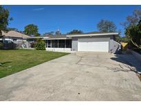 Charming single-story home with a well-maintained front yard and a two-car garage at 4753 48Th N Ave, St Petersburg, FL 33714