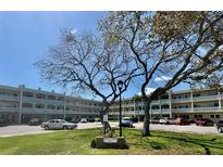 Charming condo building with lush landscaping and ample parking for residents and guests at 2331 Finlandia Ln # 73, Clearwater, FL 33763