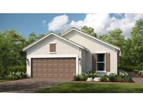 Charming single-story home featuring a two-car garage, manicured lawn, and neutral color palette at 29516 Zupetta Ln, Wesley Chapel, FL 33545