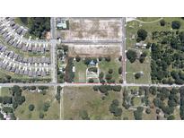 Expansive aerial view of property with surrounding neighborhood and nearby amenities at 6652 Simmons Loop, Riverview, FL 33578