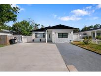 Charming single Gathering home with a beautifully landscaped yard and a long, spacious driveway at 1820 Mississippi Ave Ne, St Petersburg, FL 33703