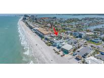 Breathtaking aerial view of the beautiful beachside home, showcasing the stunning coastline and surrounding neighborhood at 2800 Gulf Blvd Unit # 1A, Belleair Beach, FL 33786