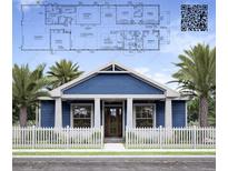 Charming single-Gathering home with a welcoming front porch, white picket fence, and lush landscaping at 324 3Rd N Ave, Safety Harbor, FL 34695