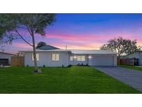 Charming single-story home featuring a freshly painted exterior, updated landscaping, and a spacious front yard at 3404 33Rd Street W Ct, Bradenton, FL 34205