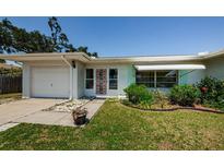Charming single-story home featuring a well-maintained lawn and inviting curb appeal at 1524 Lemon St, Clearwater, FL 33756