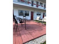 Relaxing patio featuring lounge chairs and an awning for shade at 2050 58Th N Ave # 6, St Petersburg, FL 33714