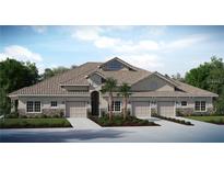 Inviting townhome exterior featuring a tile roof, neutral stucco, and well manicured tropical landscaping in the front at 29823 Ganga Way, Wesley Chapel, FL 33543