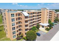 Stunning condo building with balconies, parking, and lush landscaping, perfect for enjoying the outdoors at 4550 Pinebrook Cir # 505, Bradenton, FL 34209