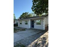 Charming single-story home featuring a well-maintained exterior and inviting front entrance at 9618 N 13Th St, Tampa, FL 33612