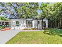 Charming single story home features a well manicured lawn, fresh landscaping, and neutral exterior at 120 12Th N Ave, Safety Harbor, FL 34695