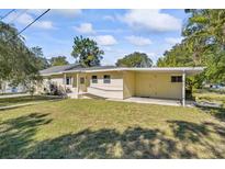 Charming single-story home with a well-maintained lawn and covered parking space at 3600 46Th N St, St Petersburg, FL 33713