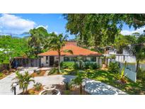 Charming single story home with mature landscaping, beautiful tile roof and circular driveway at 6213 12Th S Ave, Gulfport, FL 33707