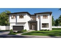 Striking modern two-story home with a clean white facade, black trim, and well-manicured landscaping at 2867 Sunstream Ln, Clearwater, FL 33759