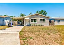 Charming single-story home featuring a carport, fresh paint and a well-maintained front yard at 2639 28Th N Ave, St Petersburg, FL 33713