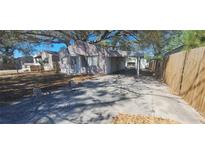 Exterior of home, showing an extended driveway, and a covered carport area at 4331 16Th S Ave, St Petersburg, FL 33711