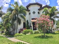 Stunning Mediterranean-style home with lush landscaping and charming architectural details at 601 Bosphorous Ave, Tampa, FL 33606