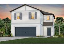 Two-story home with a modern design, attached garage, and well-manicured lawn at 9979 Trellis Vine Way, Parrish, FL 34219