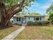 Charming single-story home with mature trees and a well-manicured lawn at 1736 23Rd N Ave, St Petersburg, FL 33710