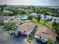 Exterior aerial showcases building's parking and surrounding landscape at 1821 Bough Ave # 4, Clearwater, FL 33760