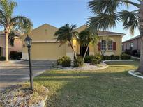 Charming single-Gathering home with well-manicured lawn and mature landscaping, offering curb appeal at 446 Noble Faire Dr, Sun City Center, FL 33573