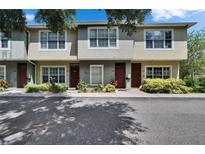 Charming townhouses with well-kept landscaping and large windows for ample natural light at 5864 Nature Terrace Cv, Tampa, FL 33617